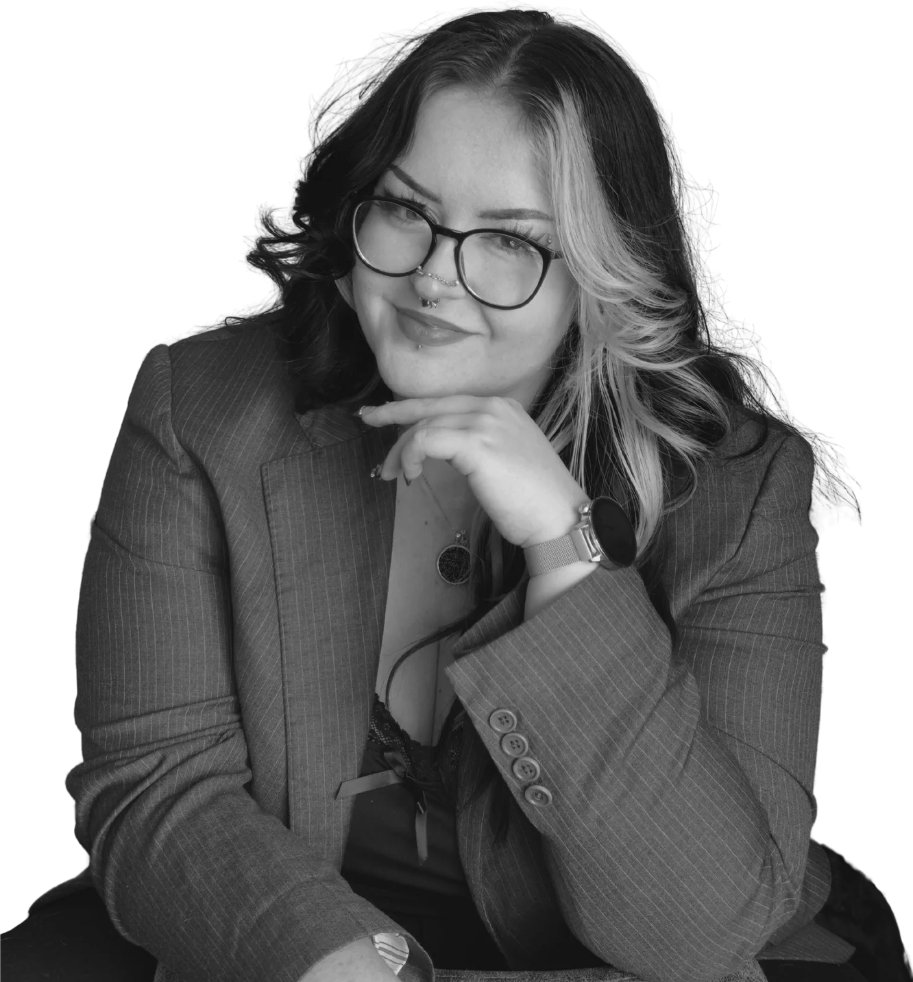 Black-and-white portrait of Sky Allen in glasses and a pinstripe blazer, chin resting on her hand